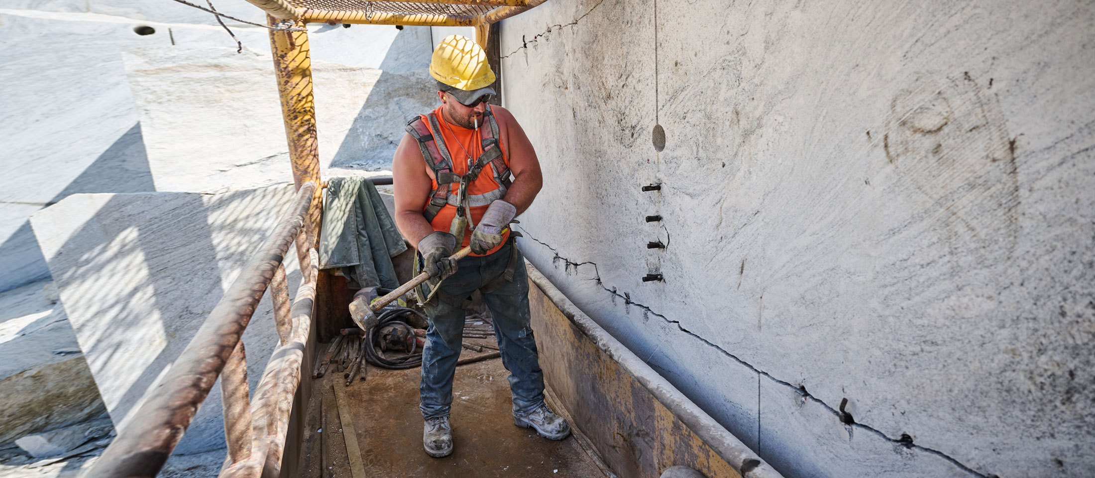 A Construction worker wearing Chippewa work boots while working on a construction site.